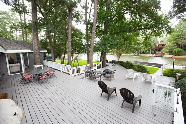 a view of backyard with swimming pool and furniture