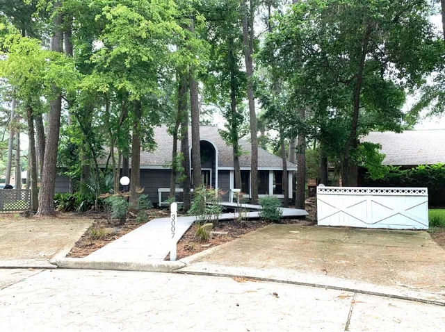 a view of a white house with a outdoor space
