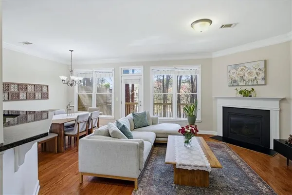 a living room with furniture fireplace and window