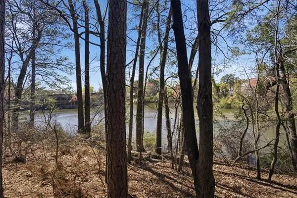 a kitchen with a sink and a white wall