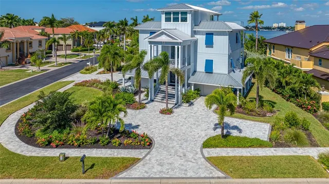 a view of a house with a yard and plants