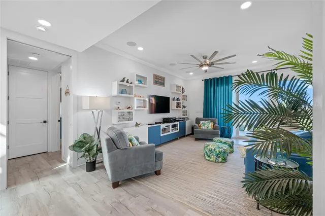 a kitchen with a sink a stove cabinets and wooden floor