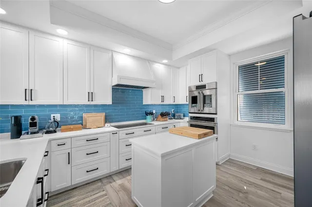 a bathroom with a double vanity sink and mirror