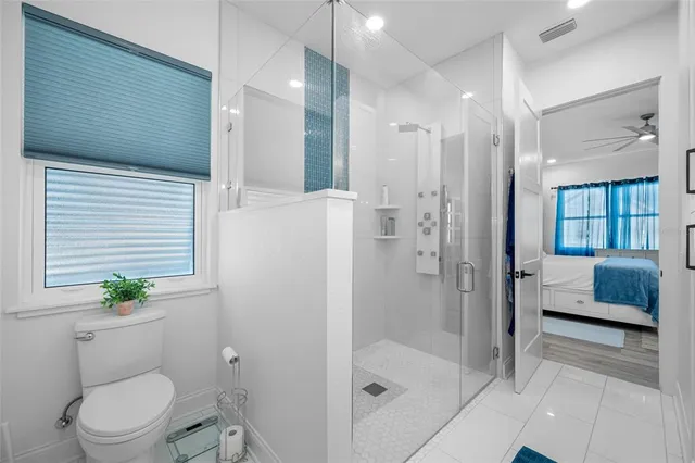 a view of empty room with wooden floor and entryway