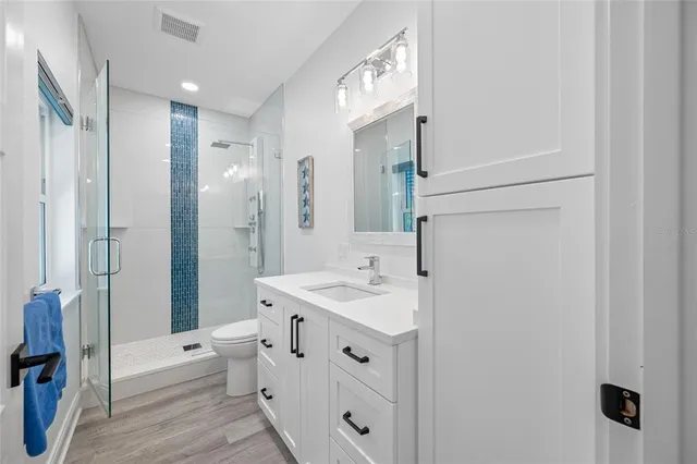 a view of a house with backyard sitting area and garden