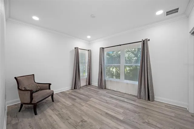 an aerial view of residential houses with outdoor space and swimming pool