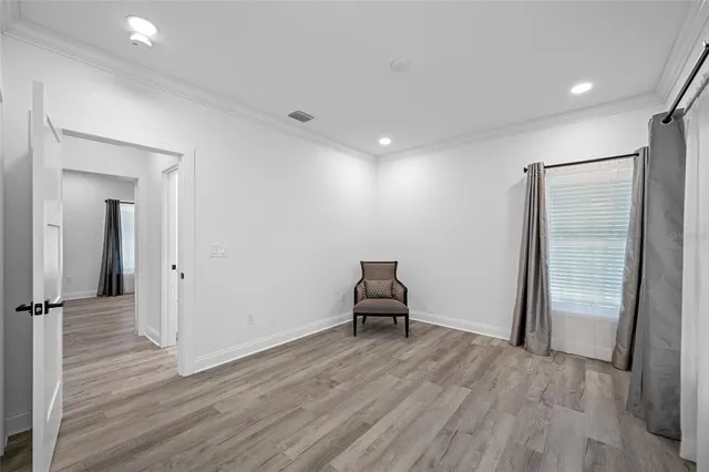 a front view of a house with a yard and a garage