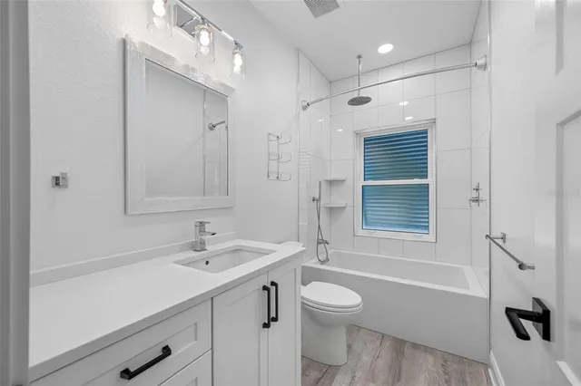 an aerial view of a house with outdoor space