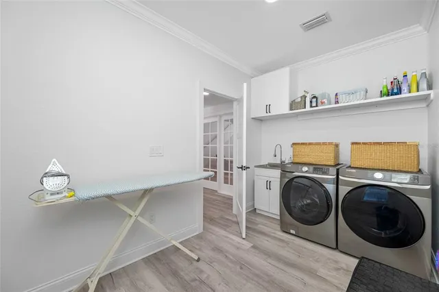 an aerial view of a house with a garden and lake view