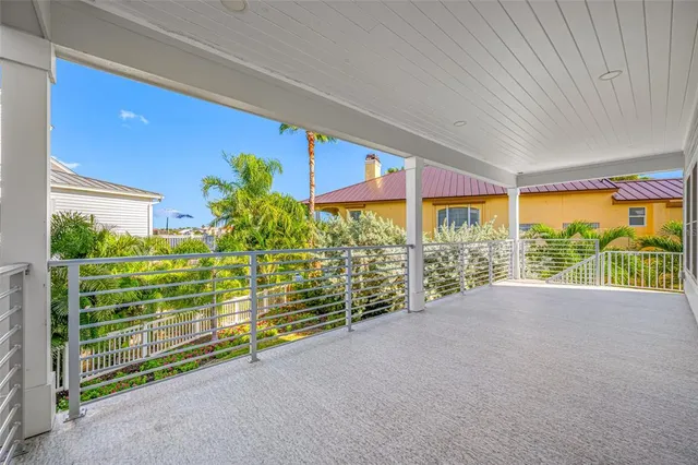an aerial view of a swimming pool with outdoor seating and plants