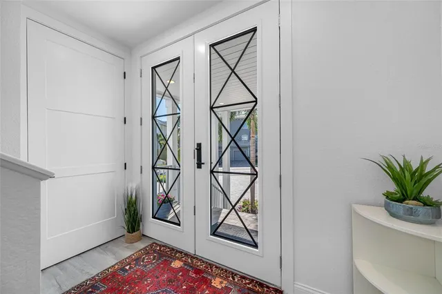 an aerial view of a house with a swimming pool yard and outdoor seating