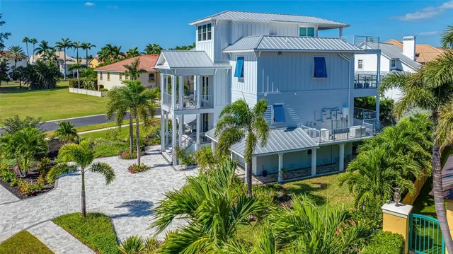 an aerial view of house with yard swimming pool and outdoor seating