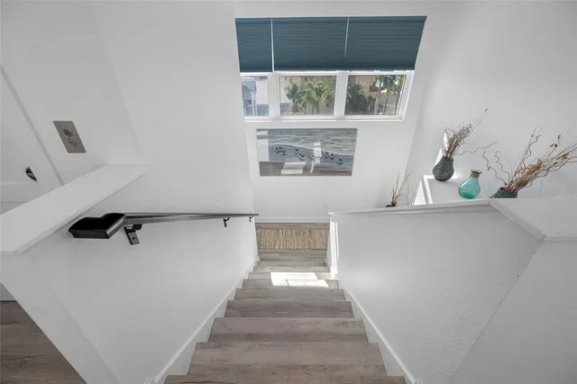 a living room with furniture ceiling fan and a window