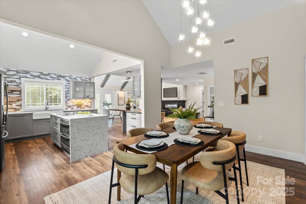 4308 Rounding Run Road Charlotte, NC 28277 - Photo 13 of 48 a kitchen with a table and chairs in it