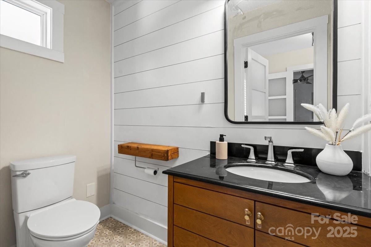 4308 Rounding Run Road Charlotte, NC 28277 - Photo 16 of 48 a bathroom with a granite countertop toilet sink and mirror