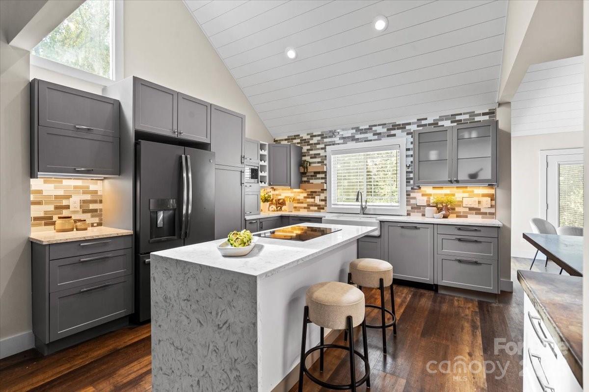 4308 Rounding Run Road Charlotte, NC 28277 - Photo 17 of 48 a kitchen with sink cabinets and wooden floor