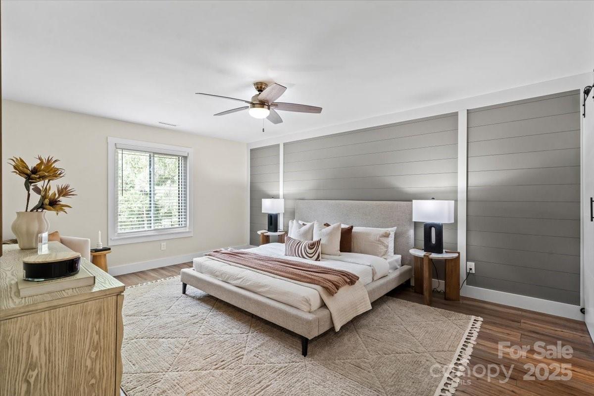 4308 Rounding Run Road Charlotte, NC 28277 - Photo 23 of 48 a spacious bedroom with a bed a couch and a window