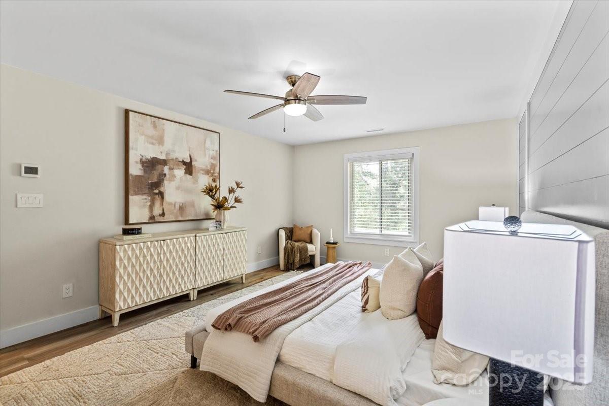 4308 Rounding Run Road Charlotte, NC 28277 - Photo 24 of 48 a bedroom with a bed and a chandelier