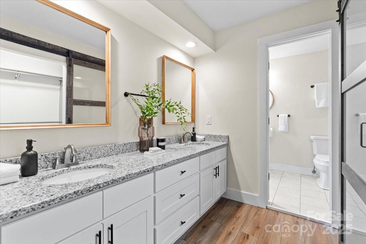 4308 Rounding Run Road Charlotte, NC 28277 - Photo 27 of 48 a bathroom with a granite countertop sink mirror and next to a window