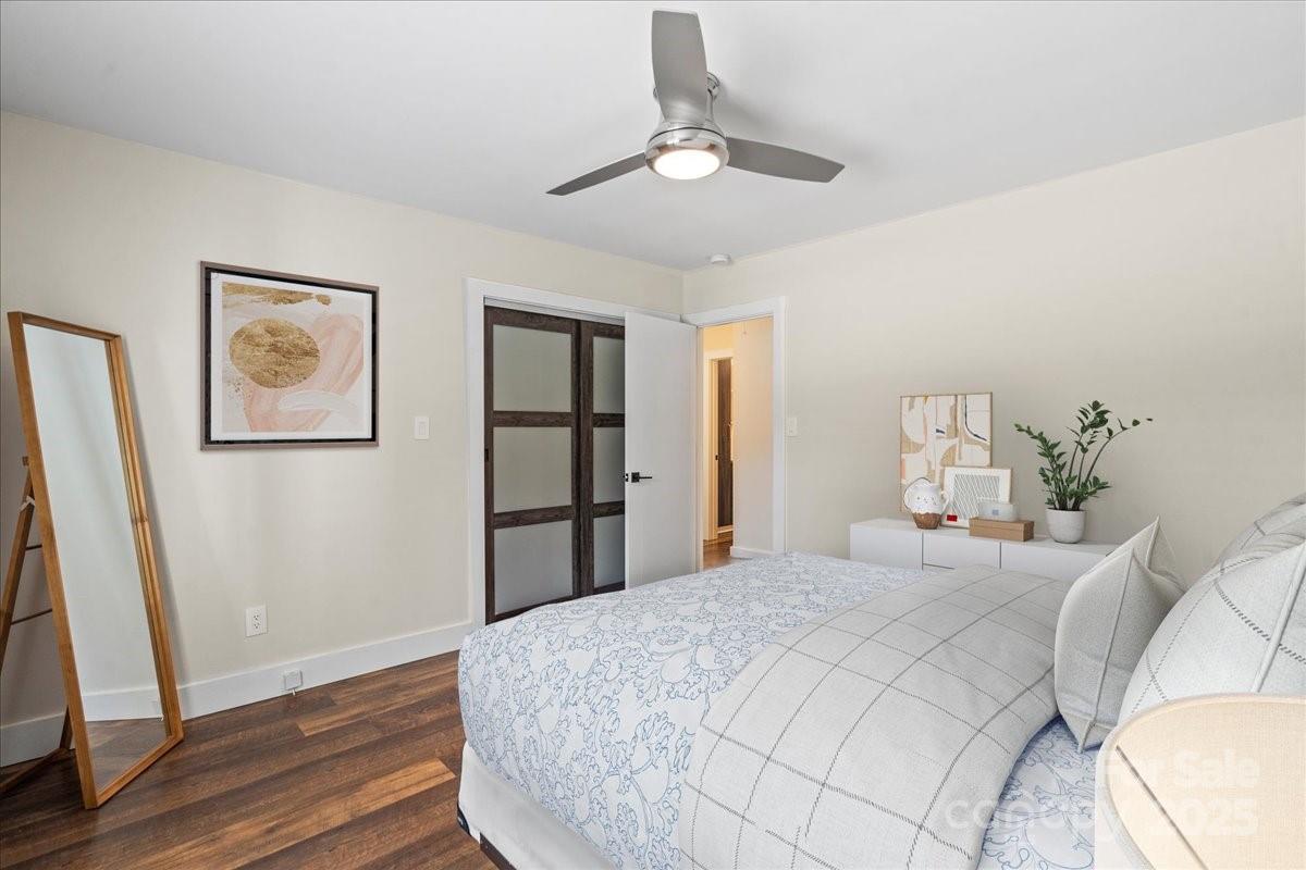 4308 Rounding Run Road Charlotte, NC 28277 - Photo 31 of 48 a bedroom with a large bed and a chandelier