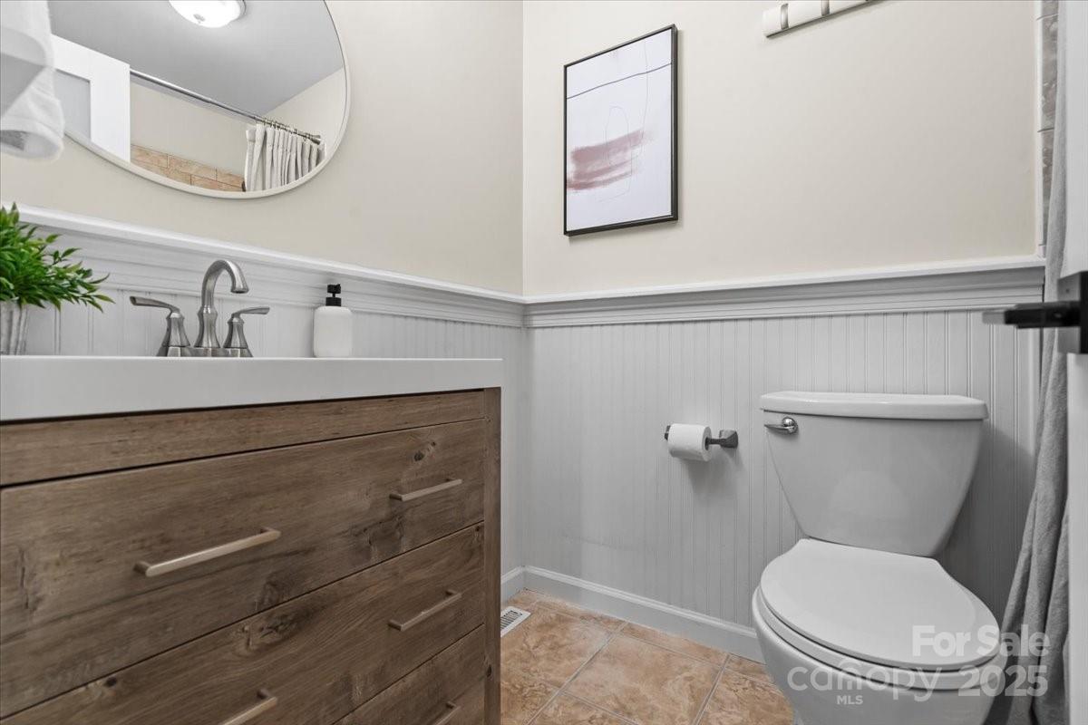 4308 Rounding Run Road Charlotte, NC 28277 - Photo 32 of 48 a bathroom with a toilet sink and mirror