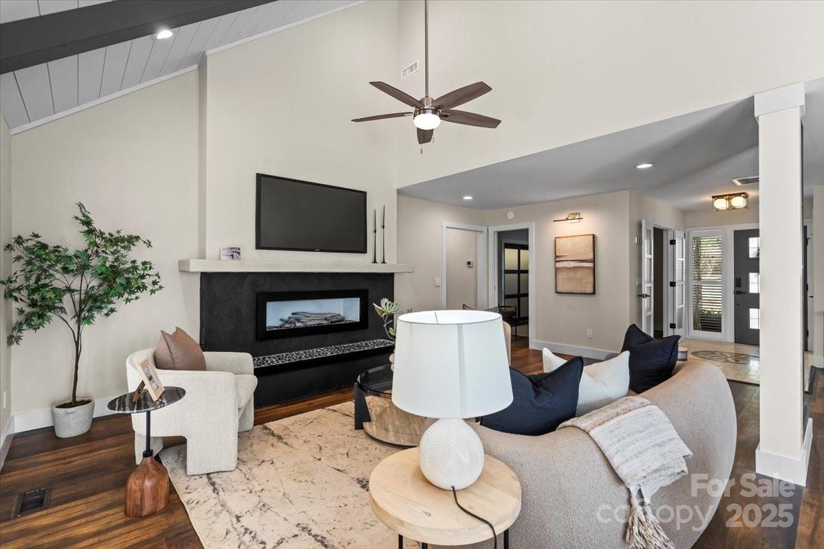 4308 Rounding Run Road Charlotte, NC 28277 - Photo 6 of 48 a living room with furniture a fireplace and a potted plant