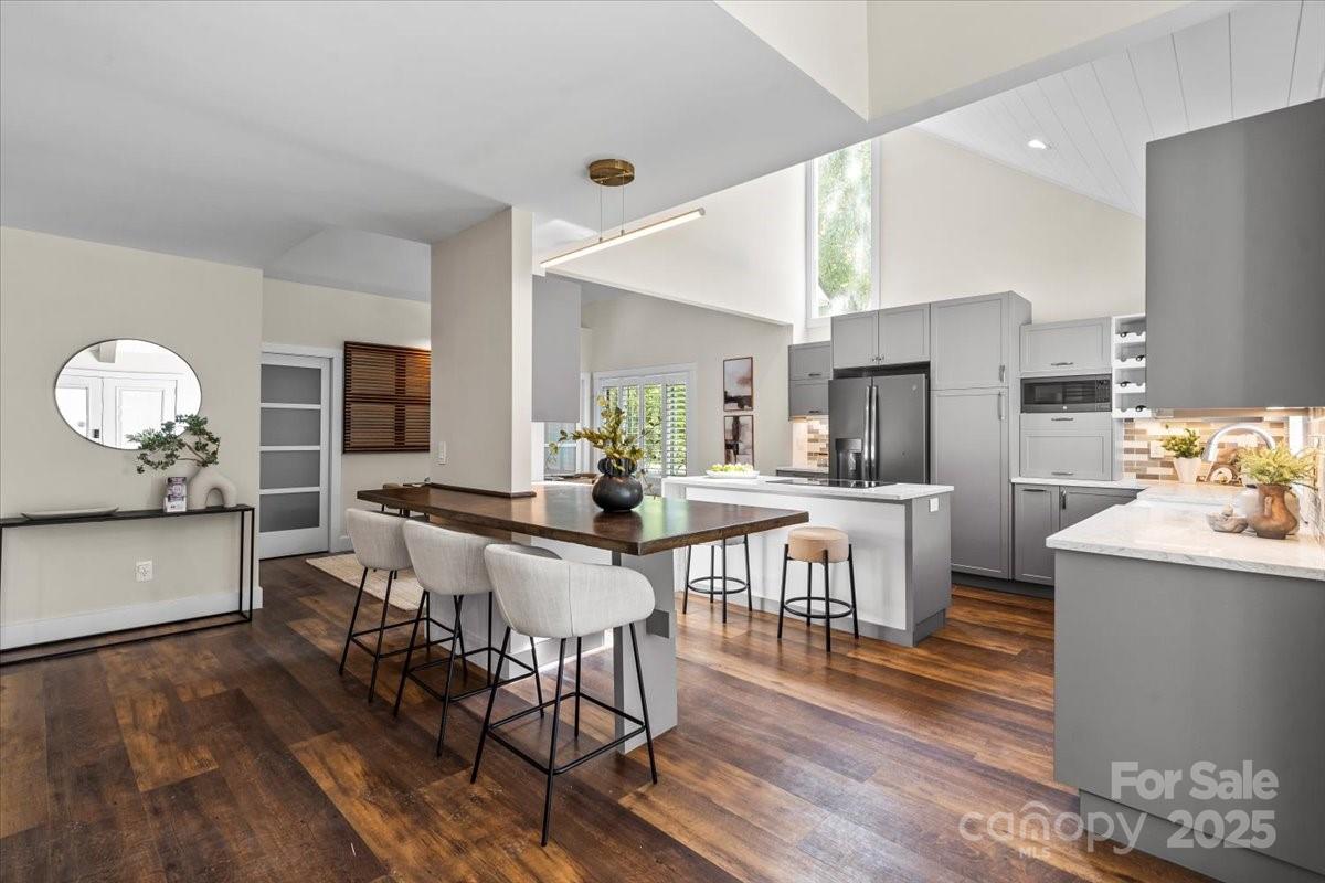 4308 Rounding Run Road Charlotte, NC 28277 - Photo 10 of 48 a view of a dining room with furniture and wooden floor