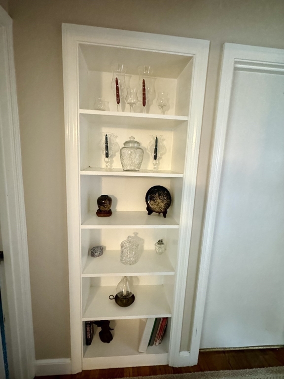 133 Bay State Road Worcester, MA 01606 - Photo 16 of 36 a view of white cabinets and a wooden floor