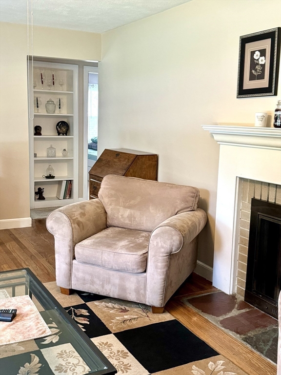133 Bay State Road Worcester, MA 01606 - Photo 17 of 36 a bedroom with a bed and a fireplace