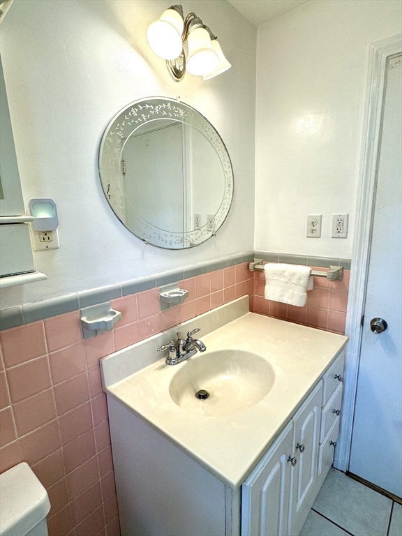 133 Bay State Road Worcester, MA 01606 - Photo 22 of 36 a bathroom with a sink and a mirror
