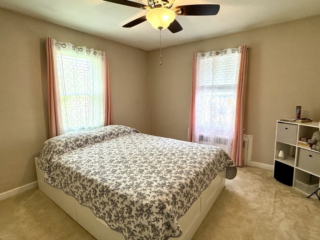 133 Bay State Road Worcester, MA 01606 - Photo 26 of 36 a bedroom with a bed and a large window