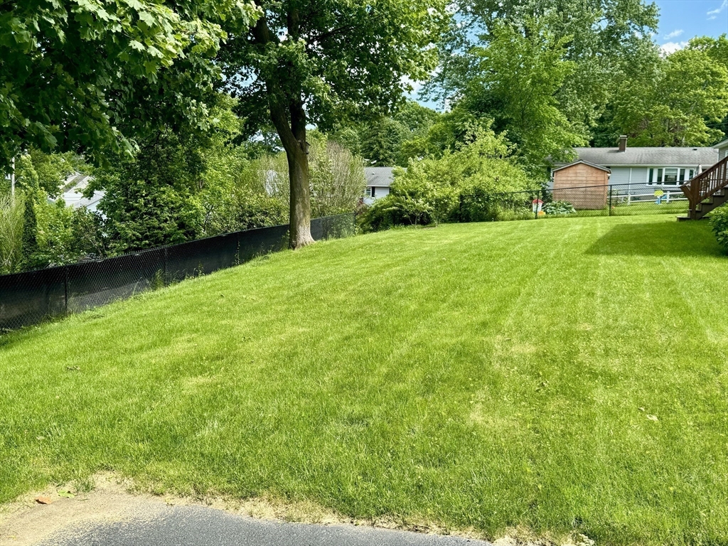 133 Bay State Road Worcester, MA 01606 - Photo 5 of 36 a view of backyard with swimming pool and green space