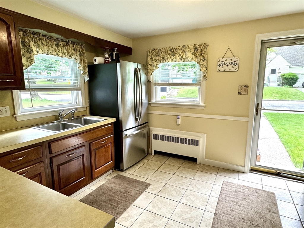 133 Bay State Road Worcester, MA 01606 - Photo 8 of 36 a kitchen with stainless steel appliances kitchen island granite countertop a refrigerator and a sink