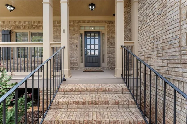 a view of a big room with wooden floor and chandelier