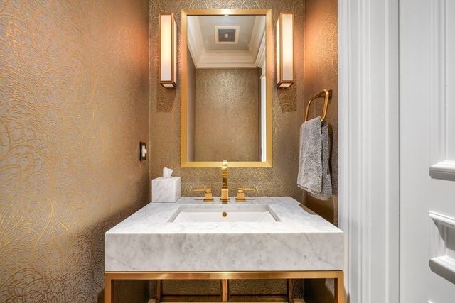 a large bedroom with a bed and glass window