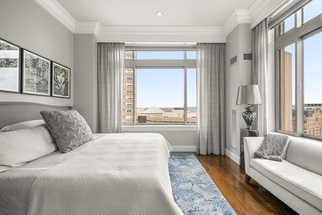 a bedroom with a bed and dresser