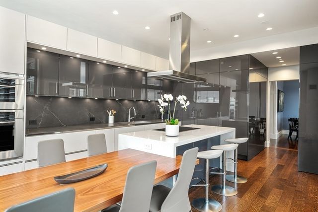 a kitchen with a table and chairs