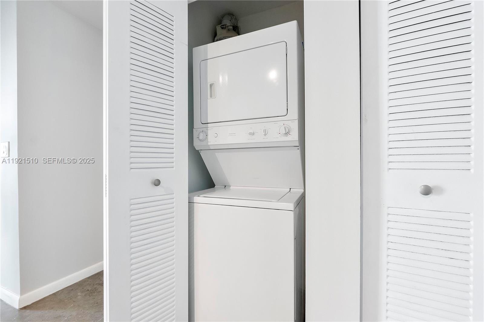 133 Northeast 2nd Avenue, Unit 508 Miami, FL 33132 - Photo 13 of 17 a utility room with dryer and washer
