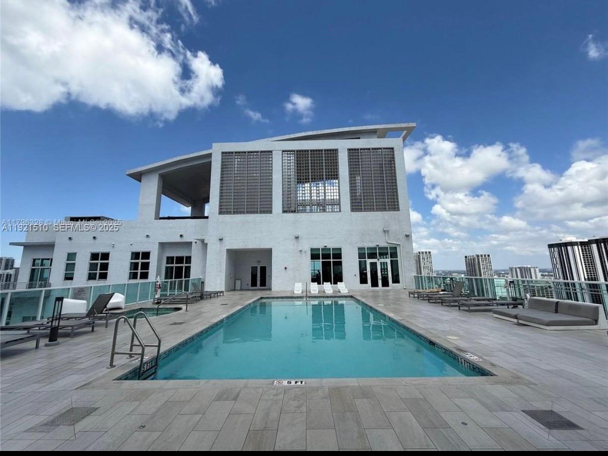 133 Northeast 2nd Avenue, Unit 508 Miami, FL 33132 - Photo 17 of 17 a swimming pool with outdoor seating