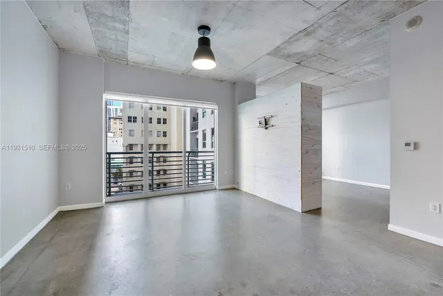 a view of a livingroom with wooden floor
