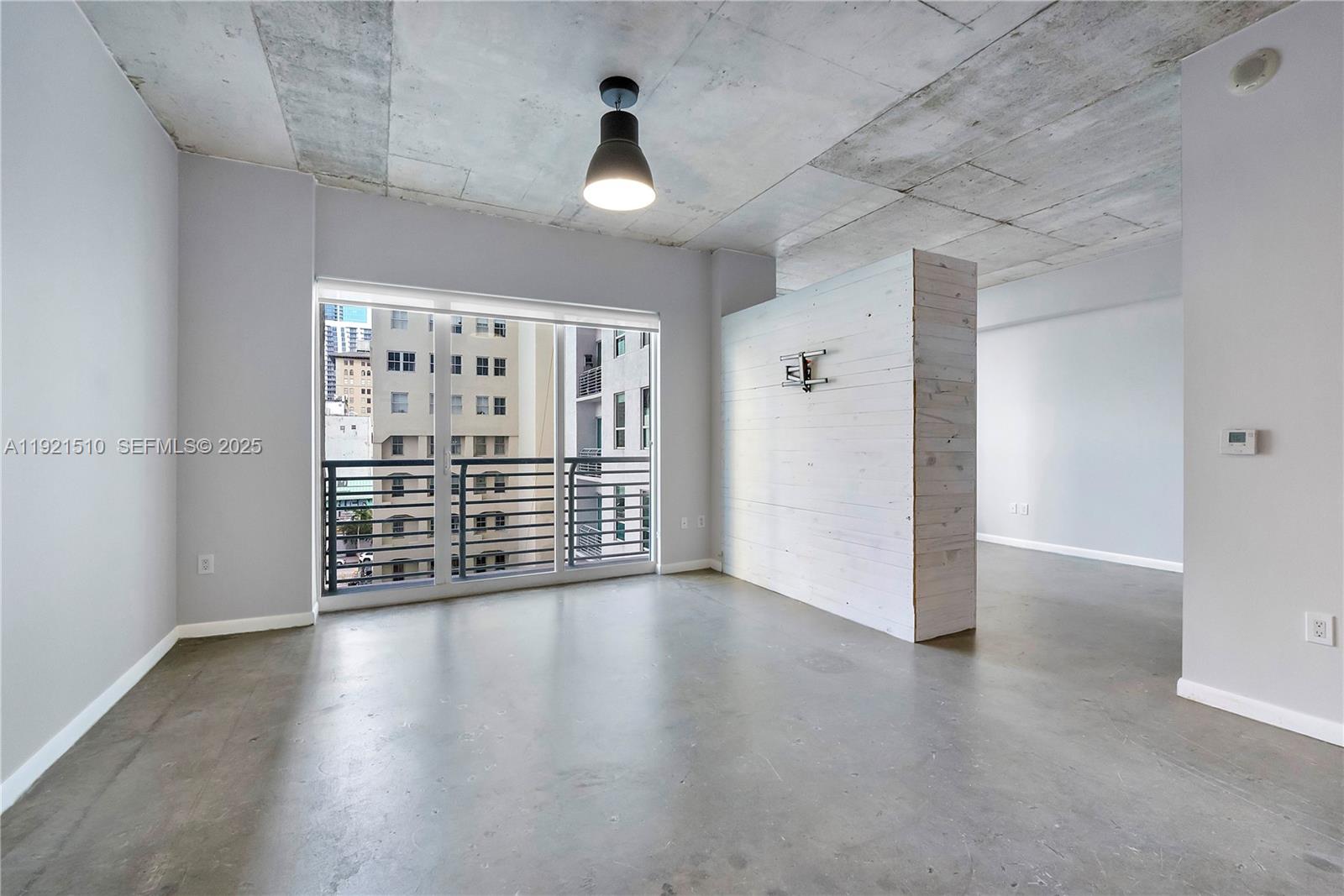 133 Northeast 2nd Avenue, Unit 508 Miami, FL 33132 - Photo 6 of 17 a view of a livingroom with wooden floor