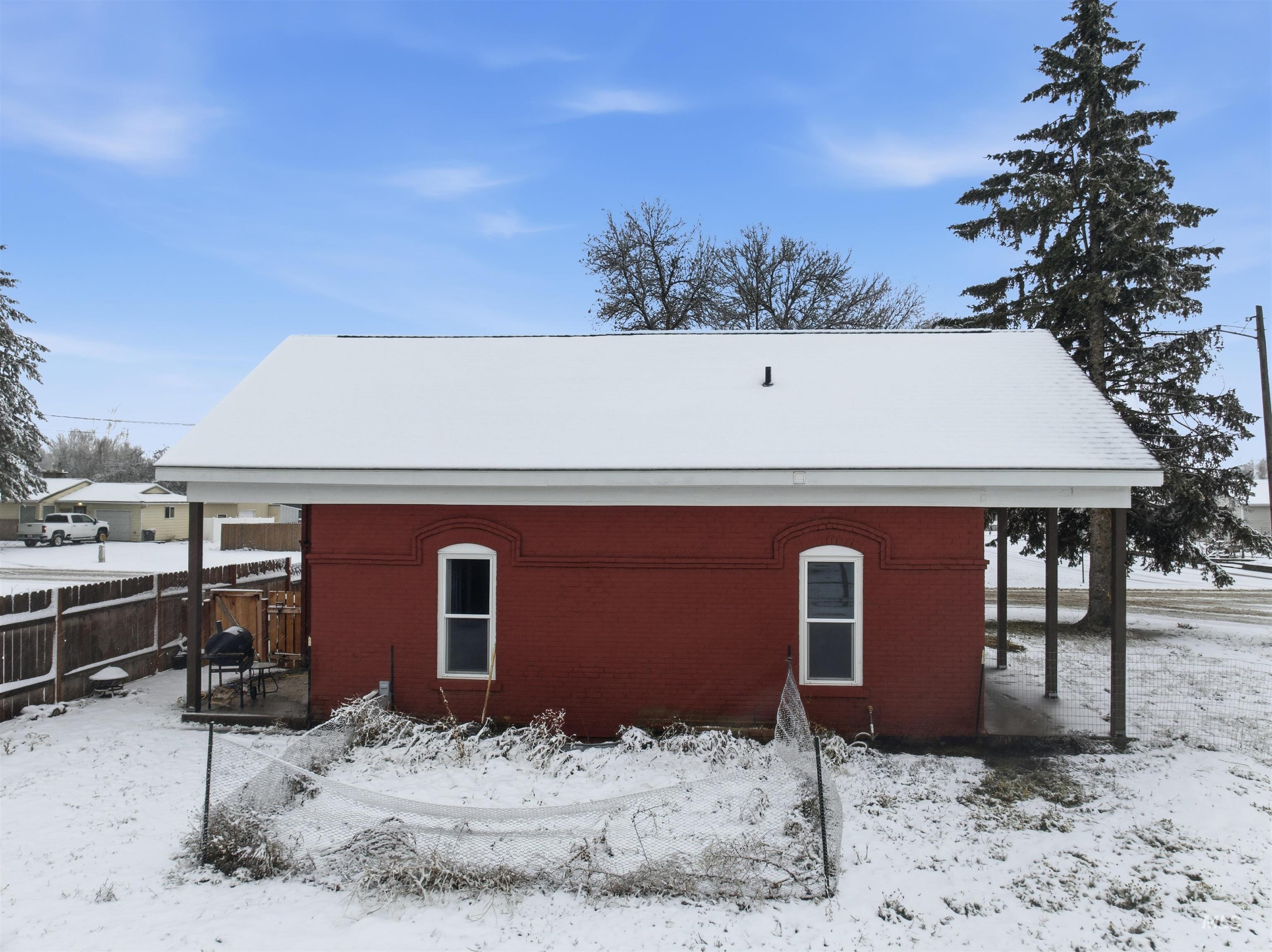 350 East Walnut Avenue Genesee, ID 83832 - Photo 20 of 27 View of snowy exterior with brick siding
