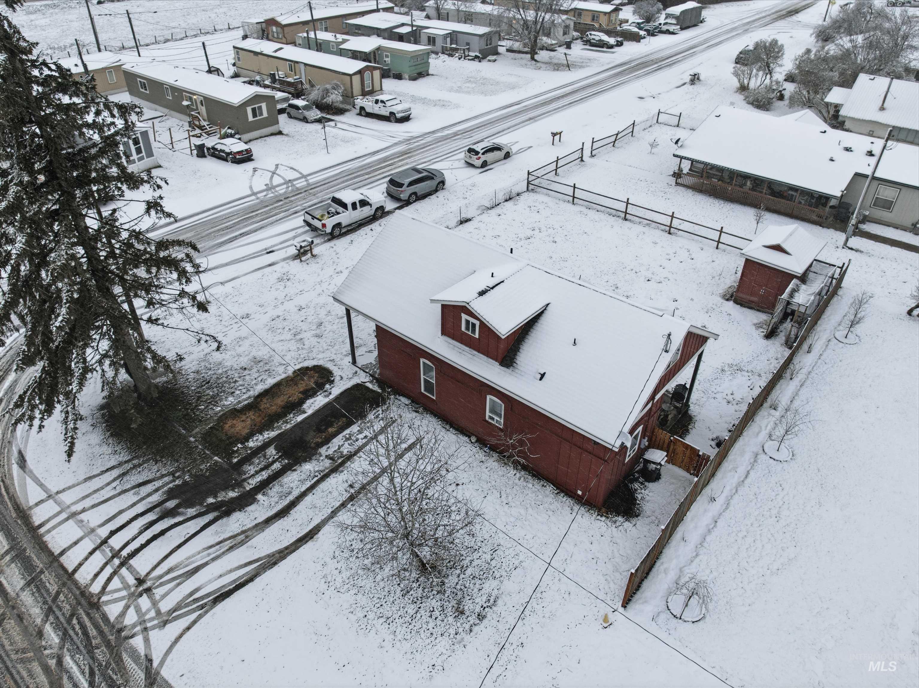 350 East Walnut Avenue Genesee, ID 83832 - Photo 21 of 27 Snowy aerial view featuring a residential view