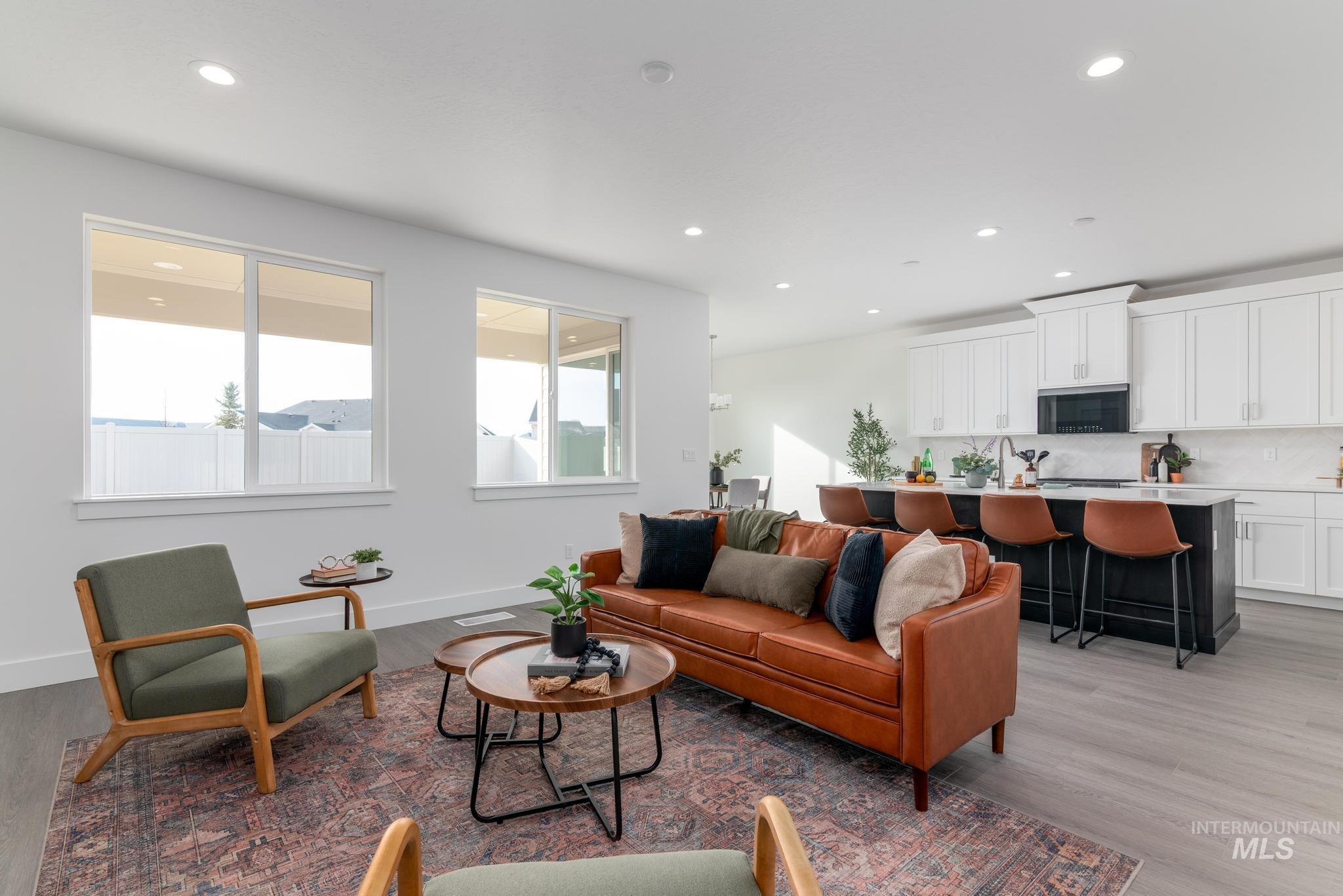 1761 West Arya Street Kuna, ID 83634 - Photo 2 of 12 Living area with light wood-type flooring and recessed lighting