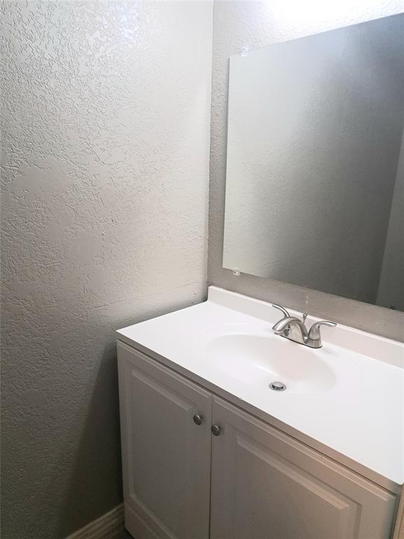 3225 Cortez Drive Fort Worth, TX 76116 - Photo 7 of 12 a bathroom with a sink and vanity