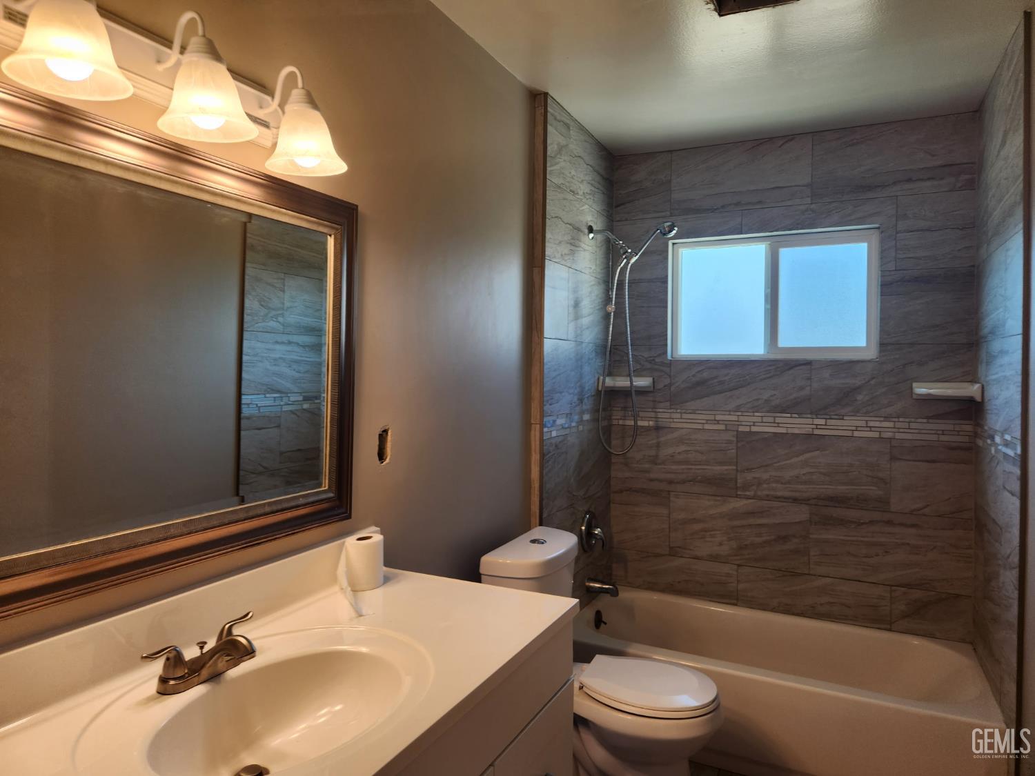 Undisclosed Address Bakersfield, CA 93309 - Photo 10 of 22 a bathroom with a sink toilet and shower