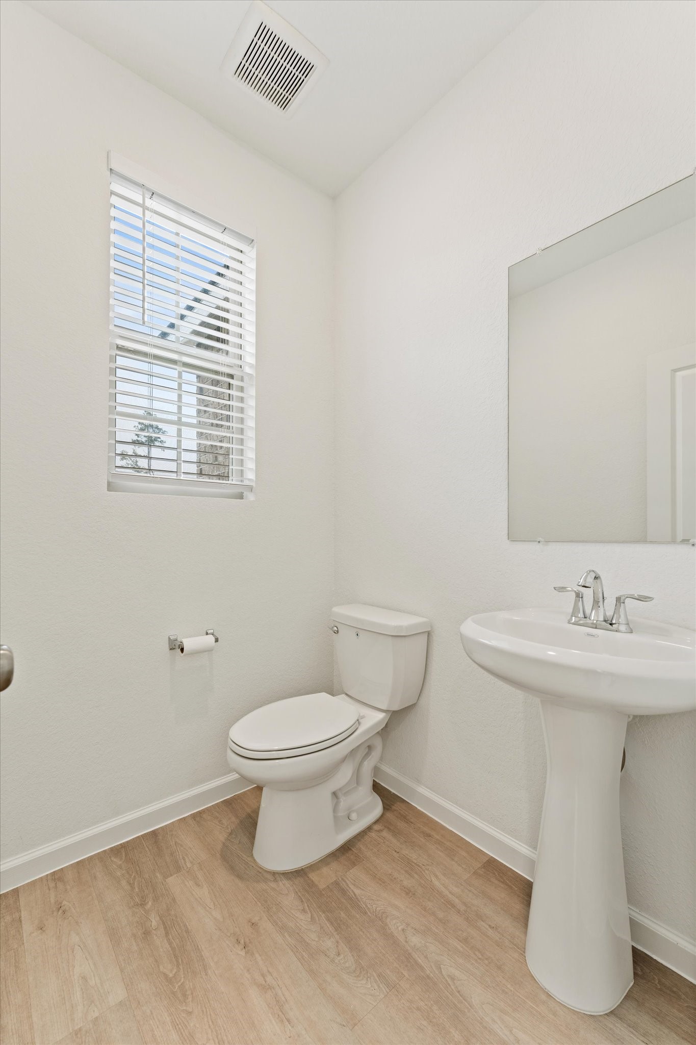 15520 Sunset Maple Court Conroe, TX 77302 - Photo 26 of 46 a bathroom with a sink toilet and a mirror