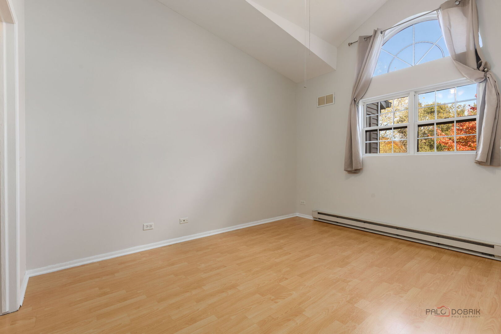 1506 Spring Brook Court, Unit 2C Round Lake Beach, IL 60073 - Photo 12 of 16 an empty room with a window