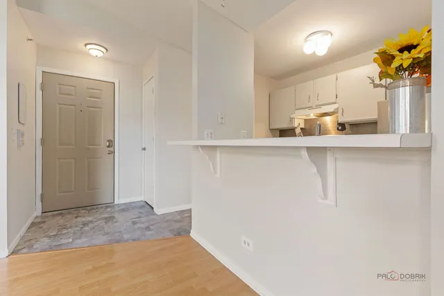 a view of a kitchen with a sink