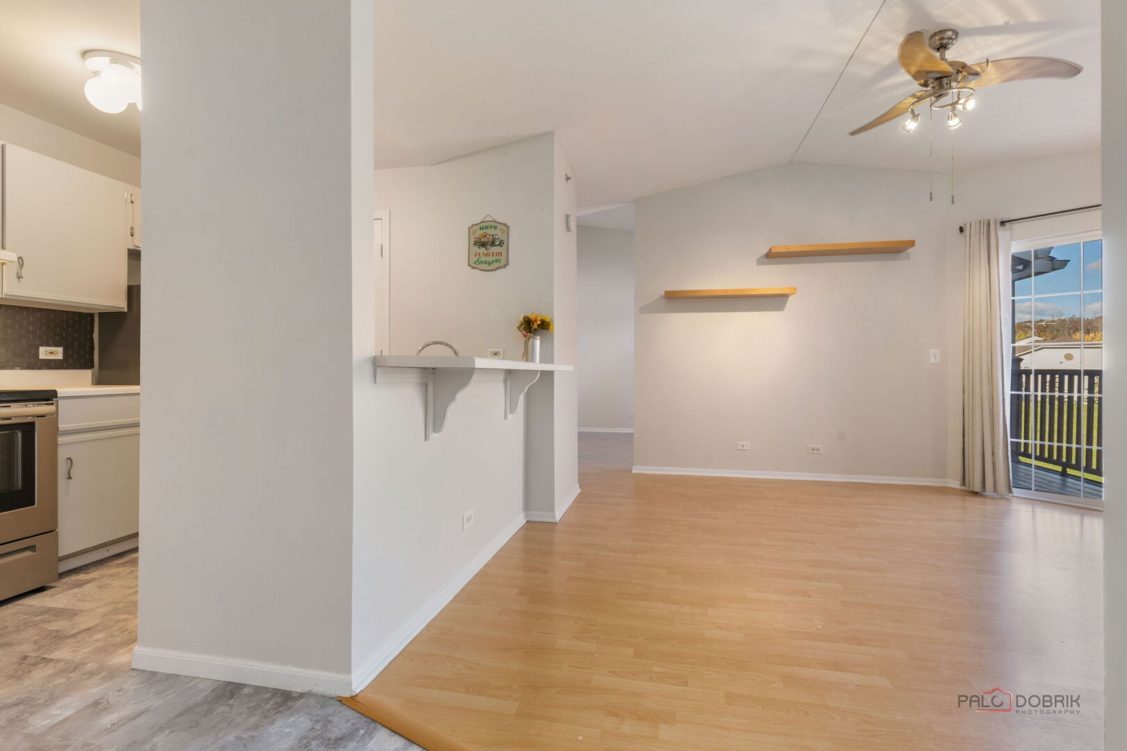 1506 Spring Brook Court, Unit 2C Round Lake Beach, IL 60073 - Photo 4 of 16 a view of empty room with wooden floor and fan